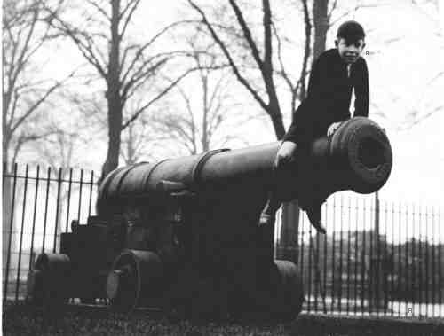1939, a photo of a schoolboy sitting astride one of the park's cannons